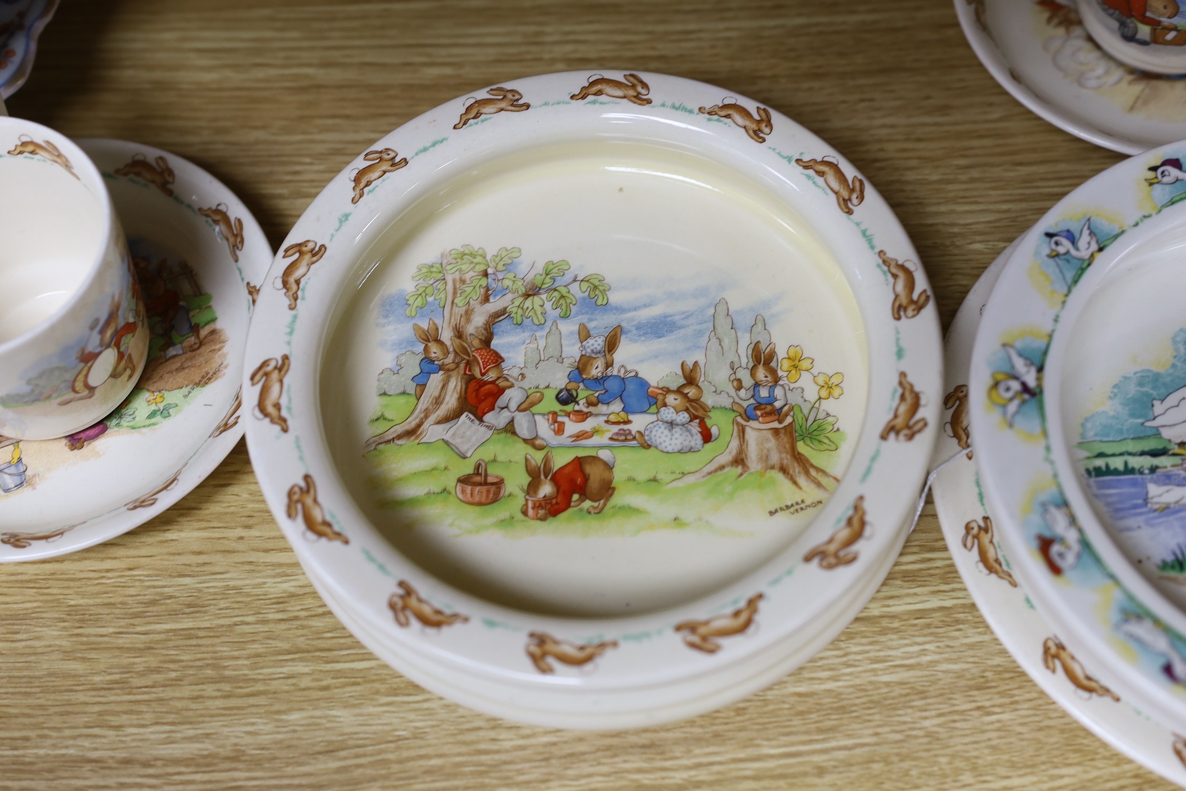 A selection of seven Royal Doulton Bunnykins tablewares, together with a Quack Quack Wade bowl